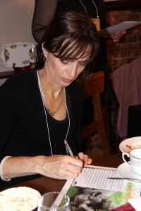 Helen Ronnenberg from Melbourne signing a Speak out for Rhinos letter